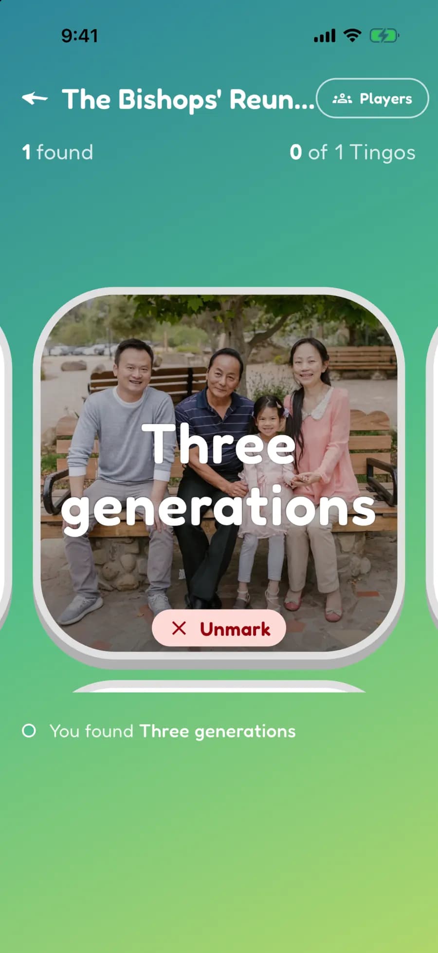 A family reunion find marked with a photo of a grandparent, parent and child together on a picnic bench.